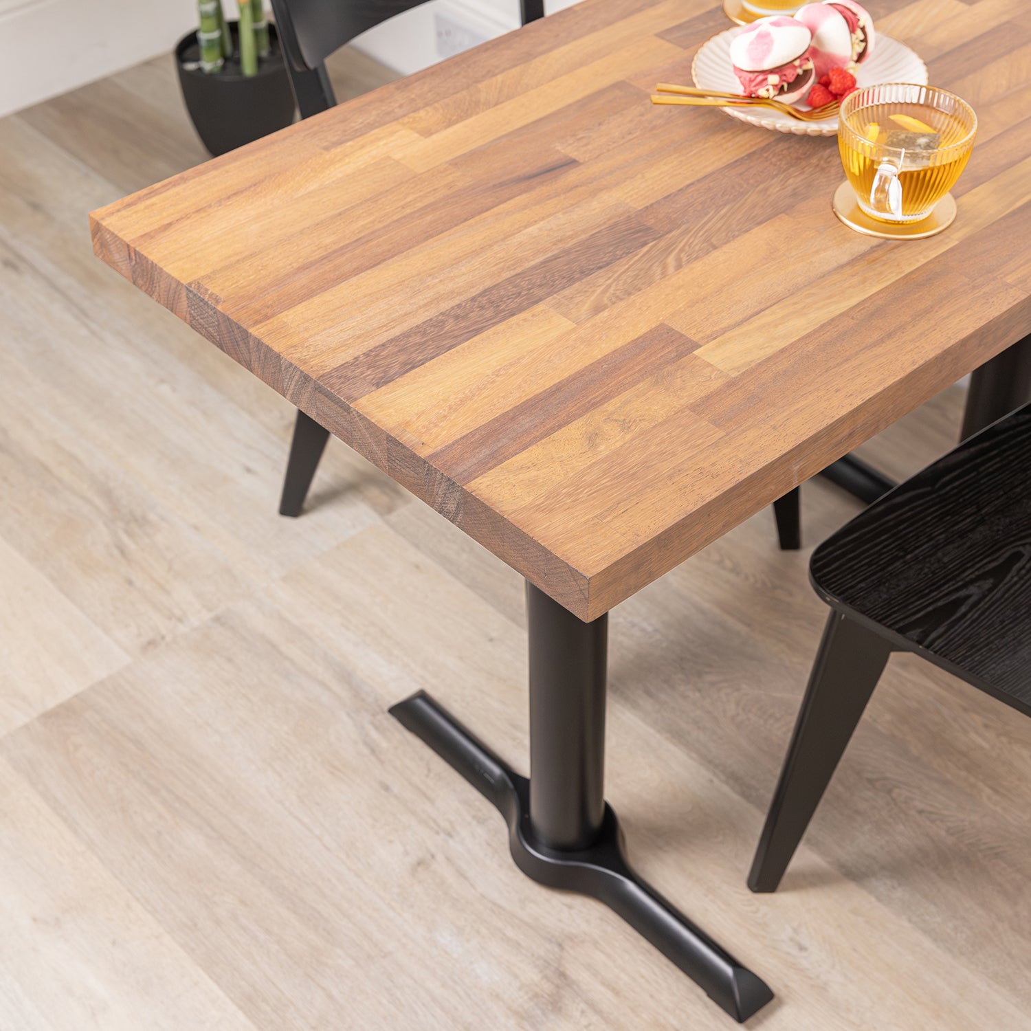 Solid Iroko Table with Black Pedestal Base Sanded